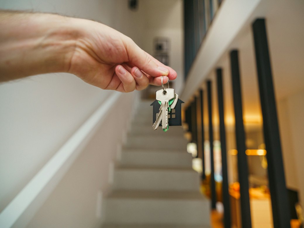 Hand holding the keys to a new home