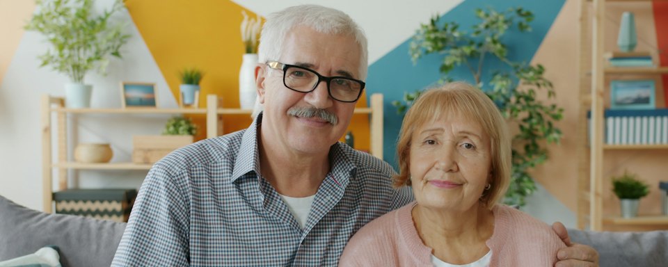 Smiling senior couple at home